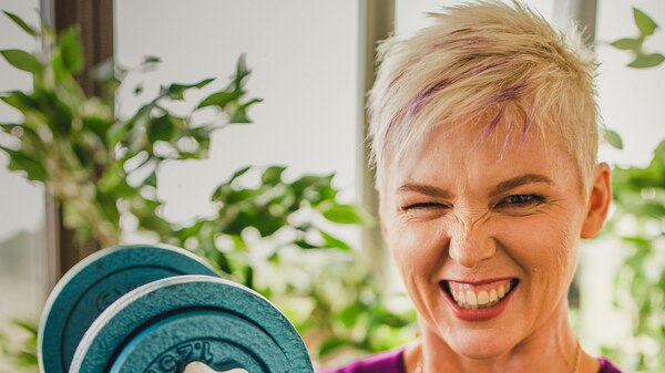 Sue Read in purple top with dumbbell