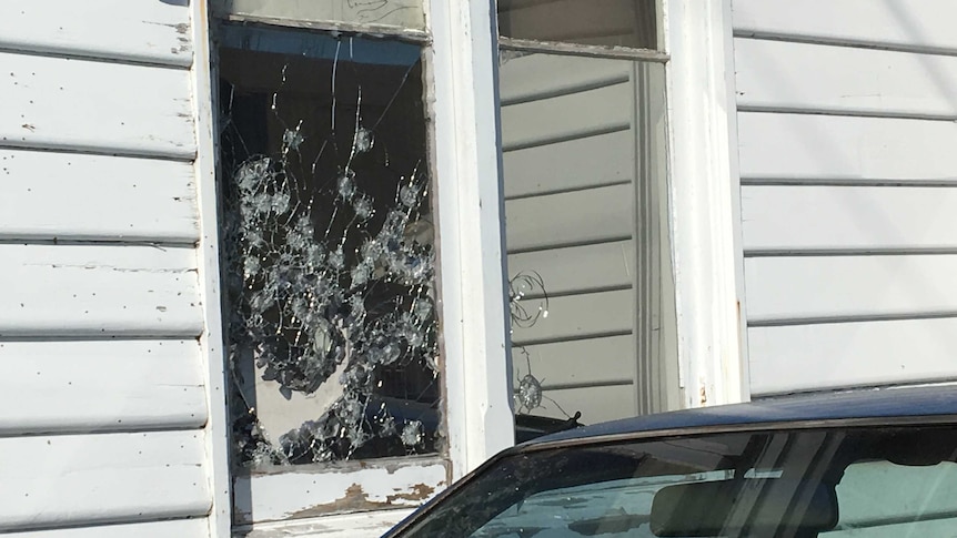 Bullet holes in window of Invermay house