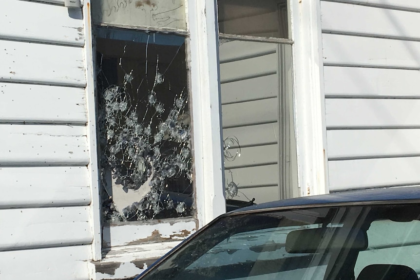 Bullet holes in window of Invermay house
