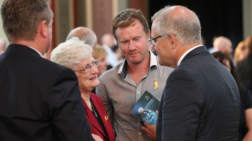 Dr Kathy Rowe speaks to Scott Morrison at the commemoration service.