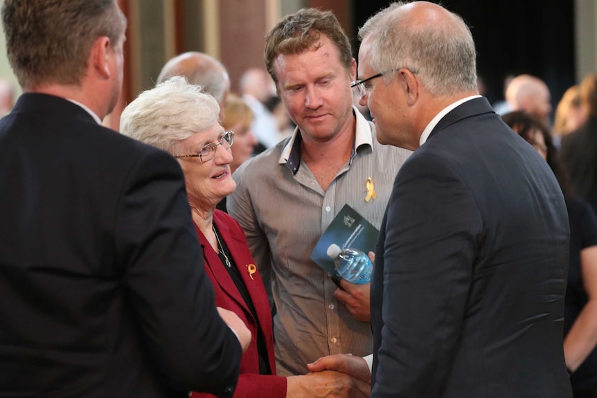 Dr Kathy Rowe speaks to Scott Morrison at the commemoration service.