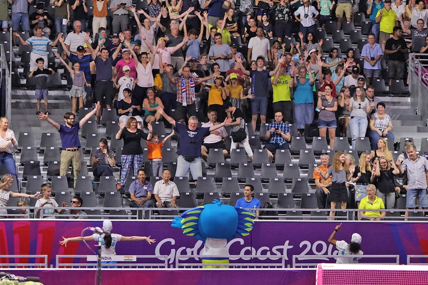 Borobi and Sid lead the crowd in a dance at the Gold Coast Commonwealth Games