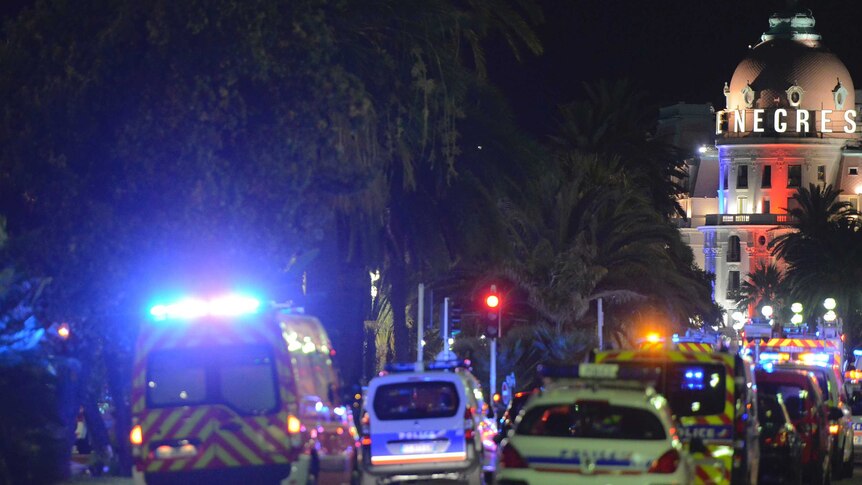 French police and rescue forces vehicles are seen on the Promenade des Anglais.