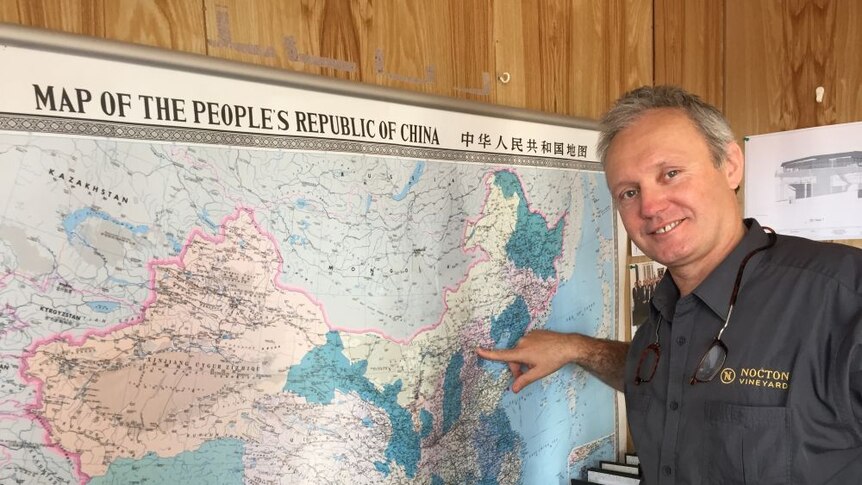 Anthony Woollams, General manager, Nocton Vineyard, Richmond Tasmania with map of China
