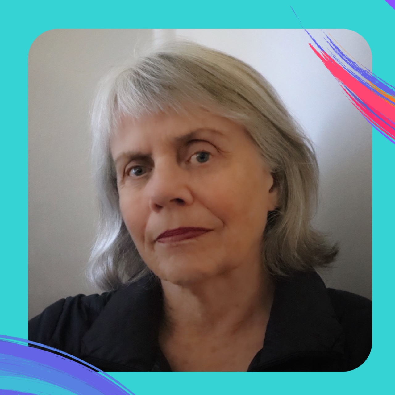 woman with grey shoulder length hair wearing black shirt