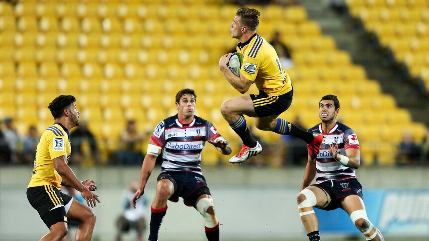 Jason Woodward leaps for the ball against the Rebels