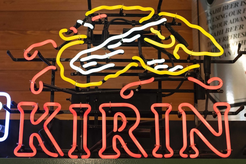Kirin Brewery Company's logo can be seen as a neon sign on at a store in Cupertino, California.
