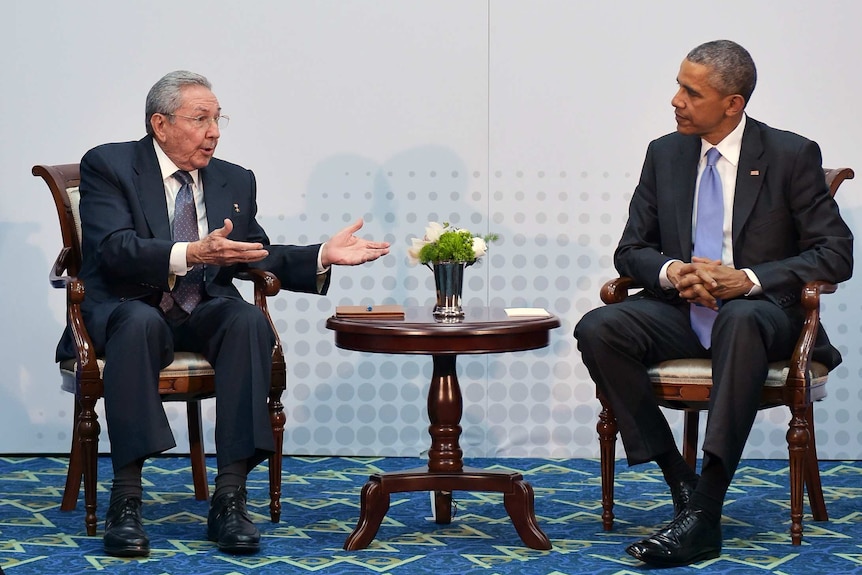 Barack Obama and Raul Castro talk at the Summit of the Americas.