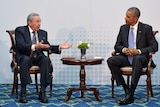 Barack Obama and Raul Castro talk at the Summit of the Americas.