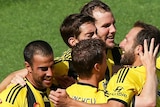 Manny Muscat (L) of the Phoenix is congratulated on his goal by teammates