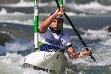 Jess Fox paddles between two poles at the K1 World Cup event