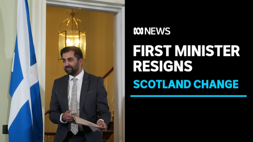 First Minister Resigns, Scotland Change: Man in suit walks through doorway next to blue and white Scottish flag.