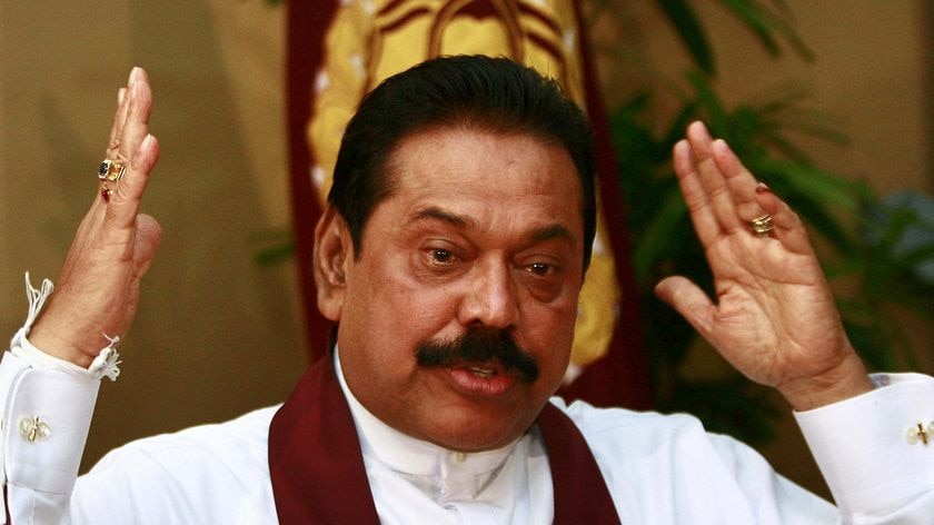 Sri Lanka's President Mahinda Rajapaksa gestures during a meeting