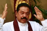 Sri Lanka's President Mahinda Rajapaksa gestures during a meeting