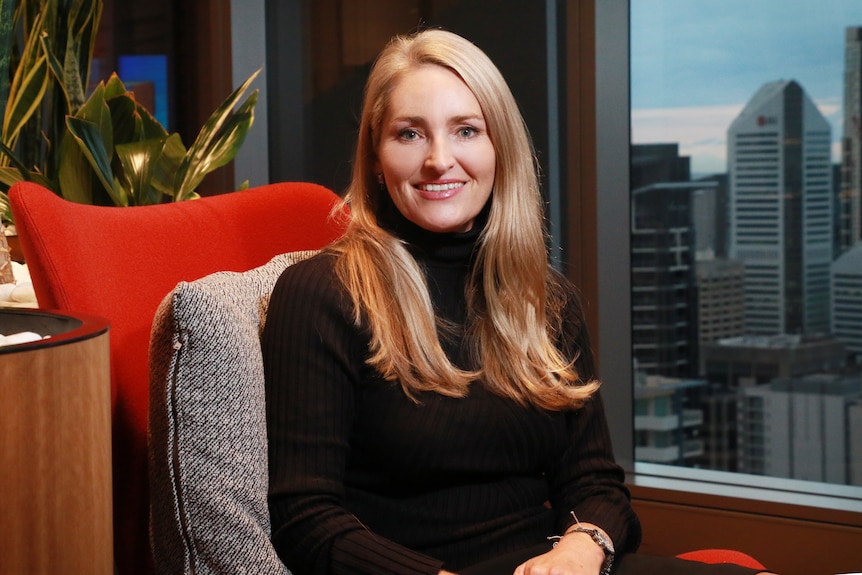 Headshot of Maree Adshead sitting in an office in Brisbane.