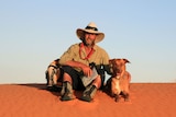 Dr David Phoenix and his dog during his walk following the track of Burke & Wills, pictured here in the Strezlecki Dessert