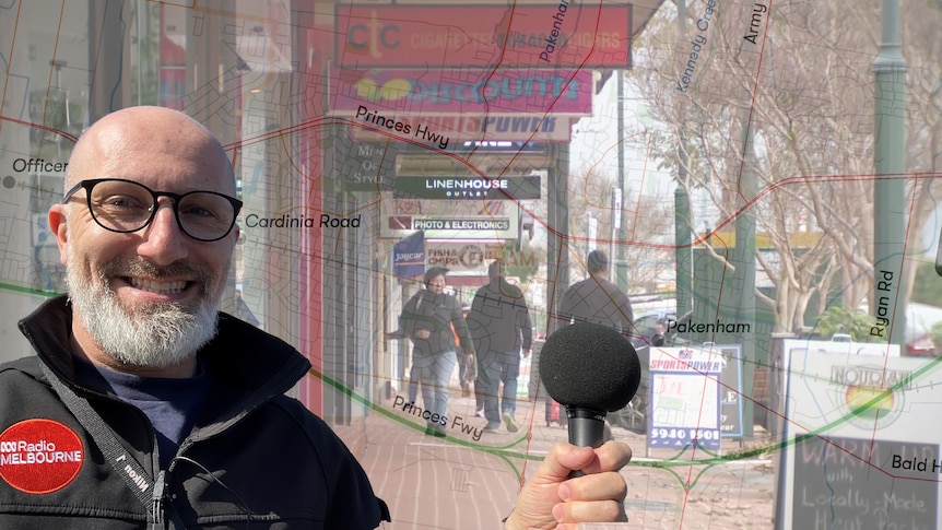 Composite image of Rafael Epstein holding a microphone in front of transparent map of Pakenham overlaid on a shopping strip.