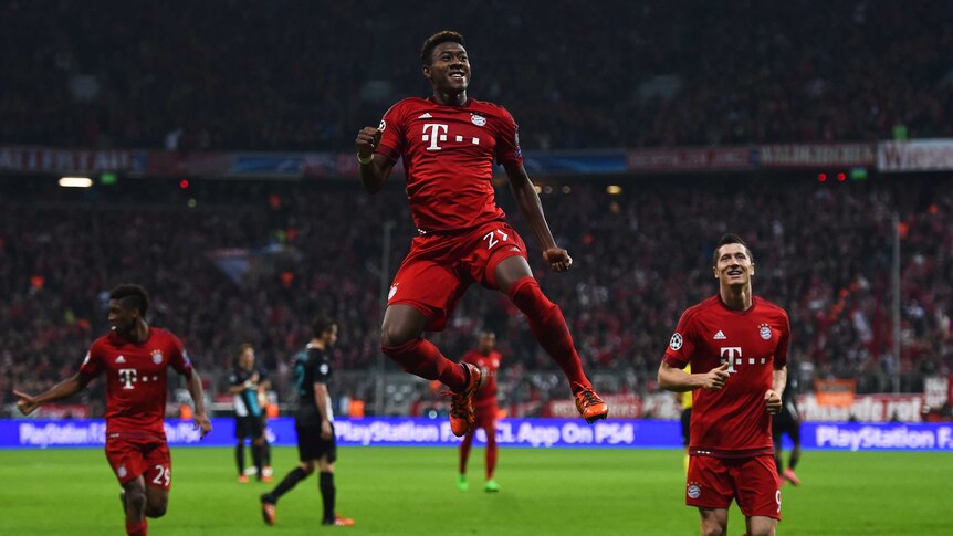 Arsenal humbled ... David Alaba celebrates scoring Bayern Munich's third goal