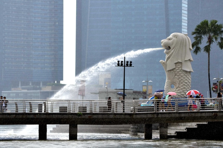 The Merlion sprays water into Singapore Harbour.