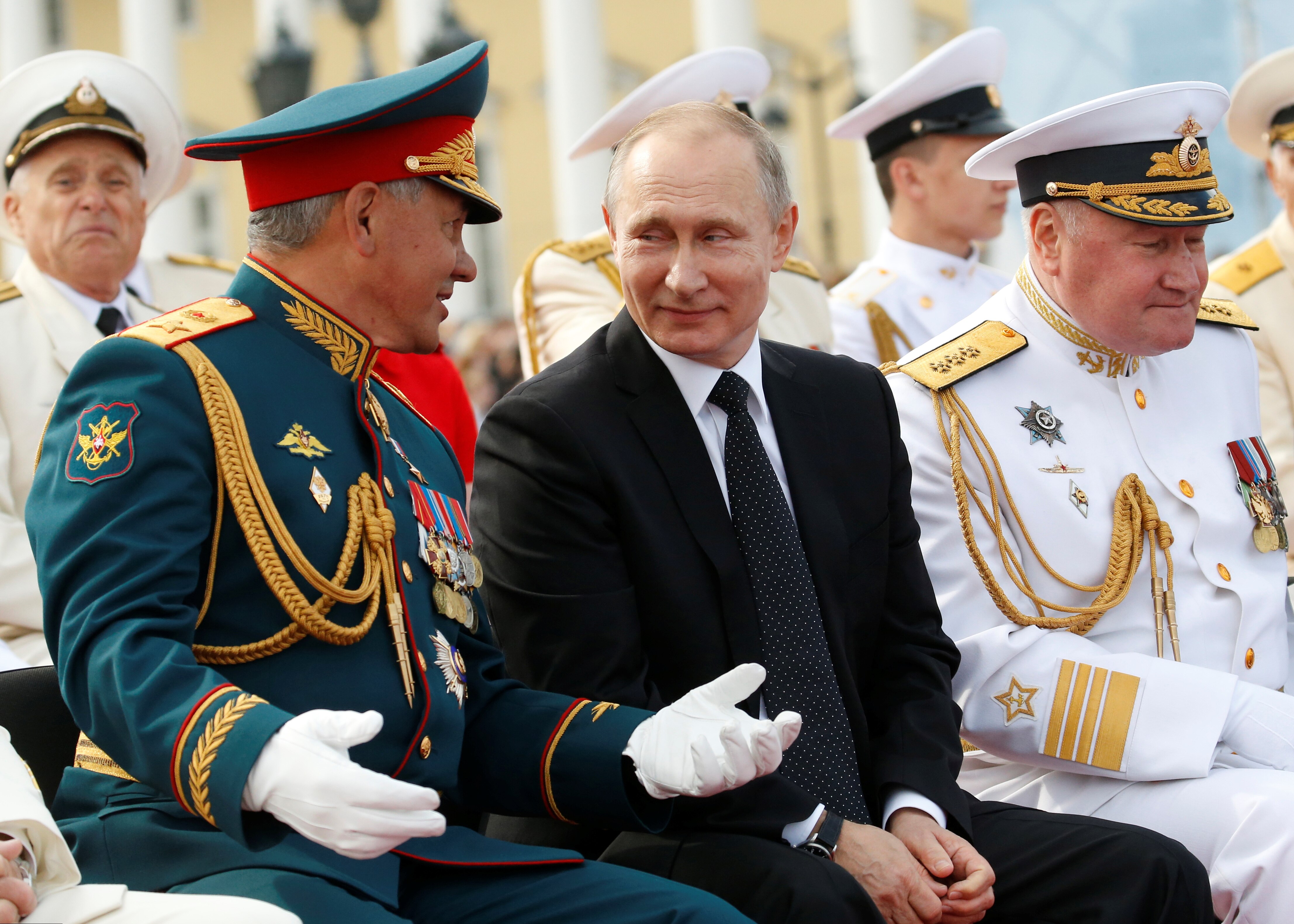 Putin and Shoigu smiling at each other 