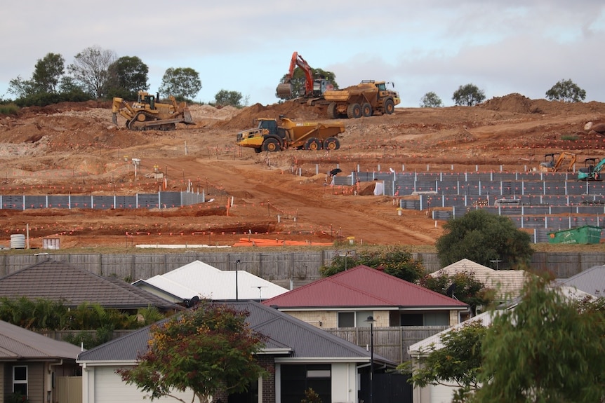 Homes being built in Ripley Valley with roofes of built homes in the foreground