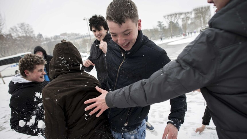 Parisian teenagers enjoy the snow