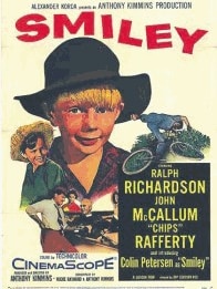 The promotional poster for the 1956 movie Smiley featuring the face of Colin Petersen who played the lead role.  