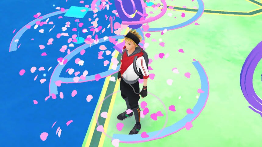 A player in mobile game Pokemon Go surrounded by Poke Stops with lures.
