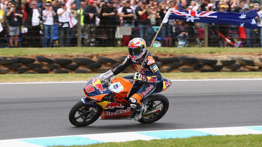 Australia's Jack Miller celebrates winning the Moto3 race at the Australian MotoGP.