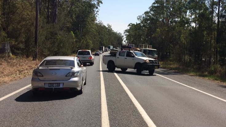 Traffic is queued for kilometres in both directions where a four-vehicle accident has closed the Pacific Highway north of Port Macquarie.