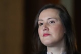 Kelly O'Dwyer looks stern at a press conference