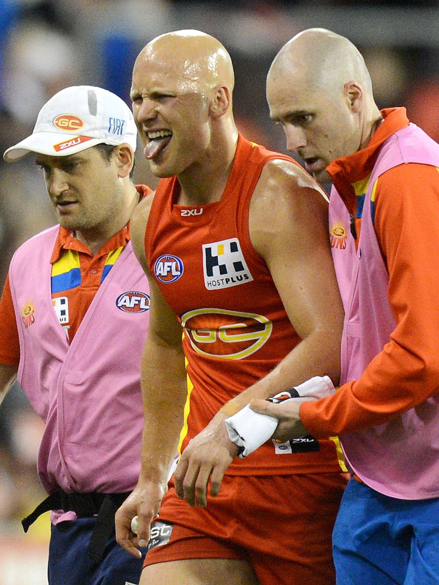 Gary Ablett is helped from the field