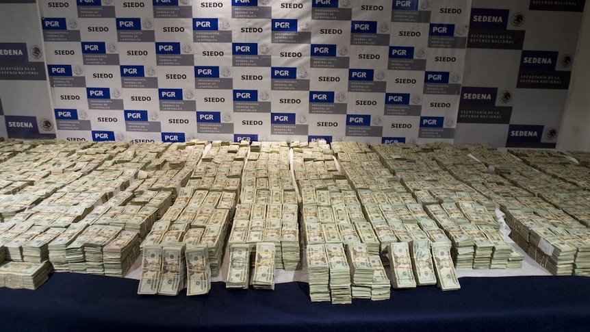 Cash seized by Mexico's Army from the Sinaloa drug cartel in 2008 is displayed to the press in Mexico City.