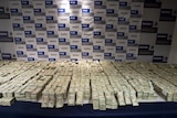 Cash seized by Mexico's Army from the Sinaloa drug cartel in 2008 is displayed to the press in Mexico City.