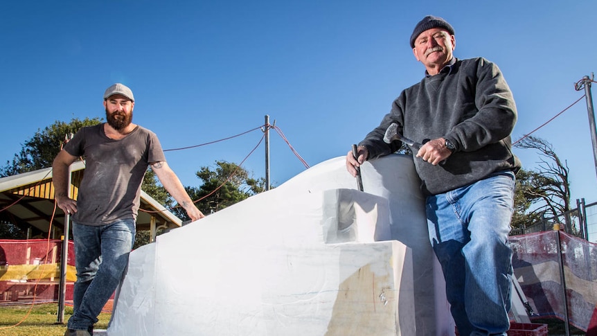 Sculptors Roger McFarlane and Gavin Vitullo with a block of marble