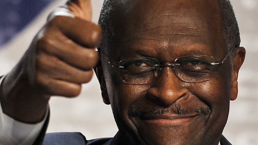 US Republican presidential hopeful Herman Cain gives the thumbs up