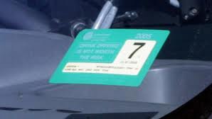 A Queensland car registration label.