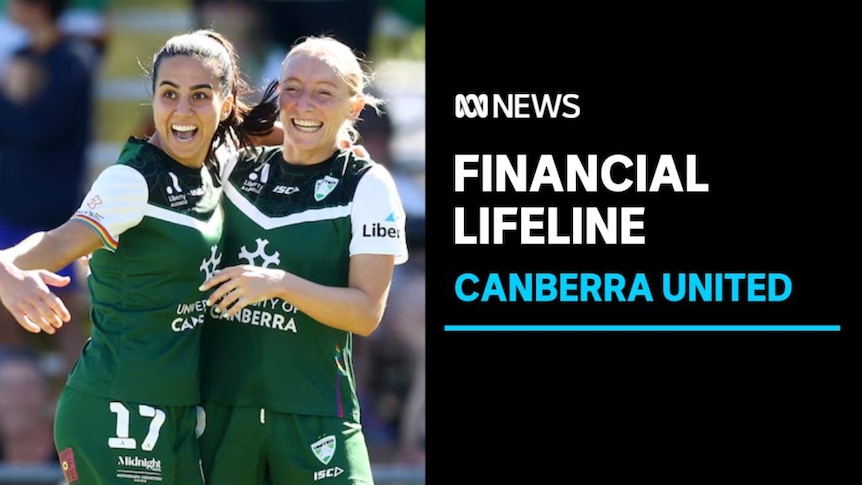 Financial Lifeline, Canberra United: Two women in soccer kits celebrate with an arm around each other mid-match.