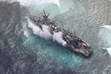 Waves crash on the USS Guardian