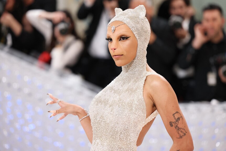 Doja Cat poses at the Met Gala, an annual fundraising gala, dressed as a cat.