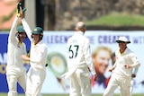 Four Australian male Test cricketers celebrate taking a wicket against Sri Lanka.