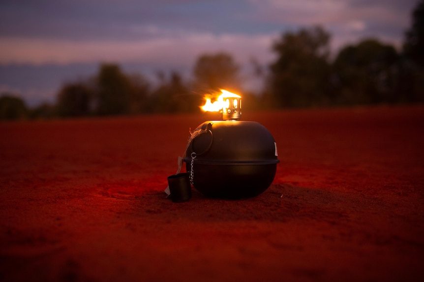 Lantern on red dirt