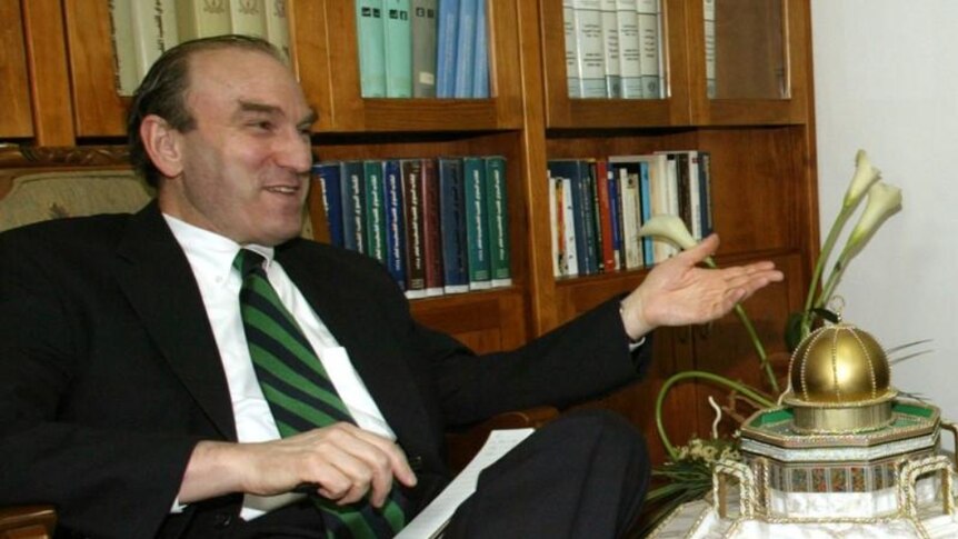 An image of former White House adviser Elliott Abrams in an office in Abu Dis, West Bank, August 2004