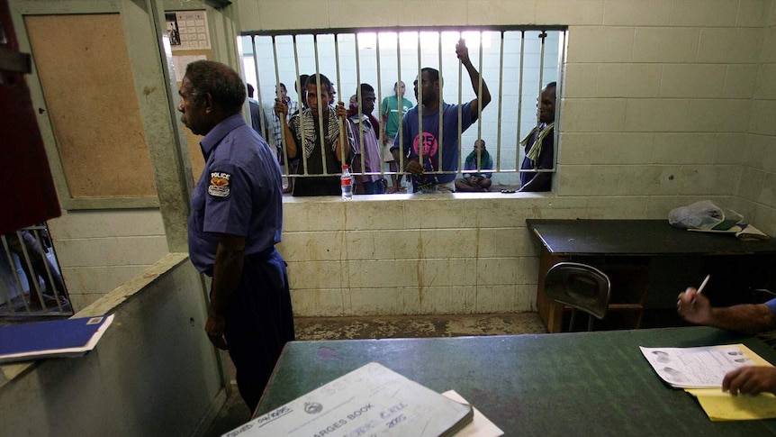 Policeman stands guard at Port Moresby jail