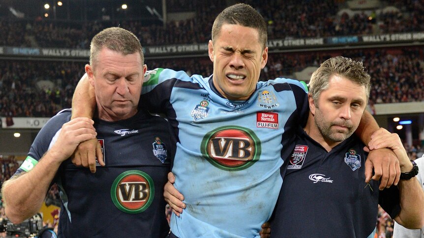 NSW player Jarryd Hayne is taken from the field after being injured during State of Origin III.