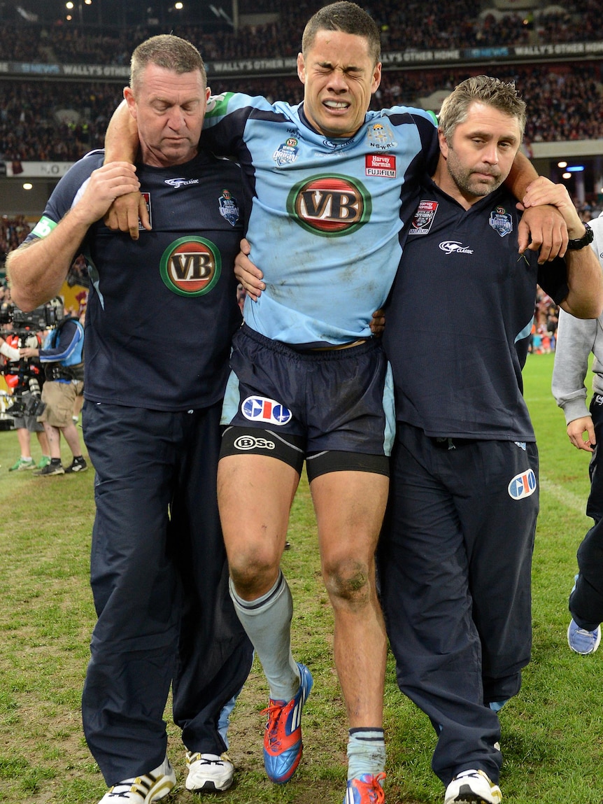 NSW player Jarryd Hayne is taken from the field after being injured during State of Origin III.