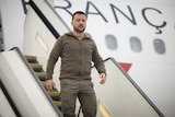 Ukraine's President Volodymyr Zelenskyy disembarks French government plane.