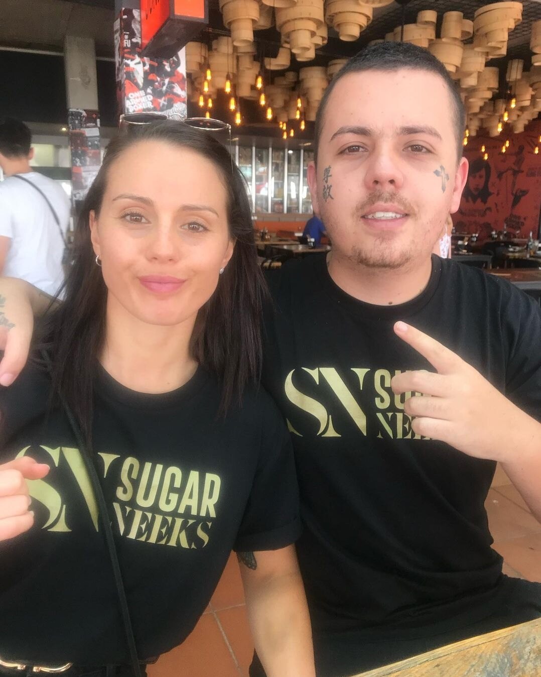 Sugar Neekz, left, and Levi Johnson, right, both smiling. Mr Johnson was killed on September 12, 2022.