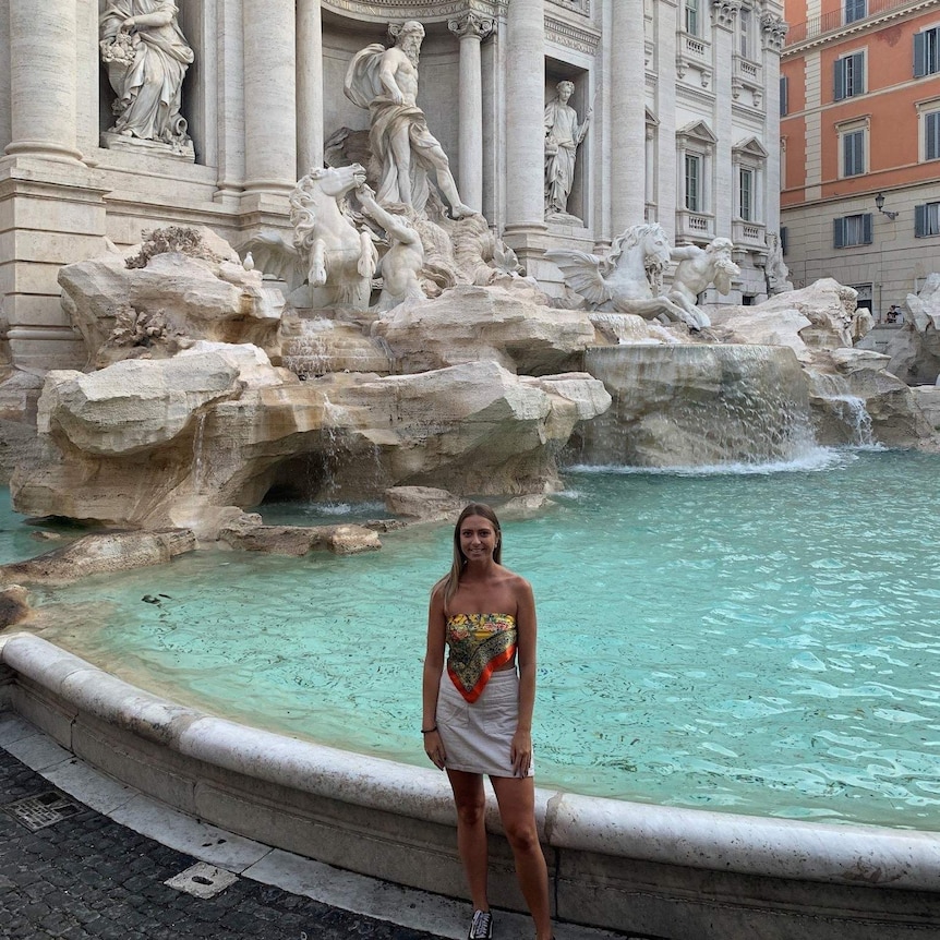 Hannah at a marble fountain.