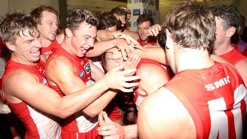 Swans players get rowdy after beating Geelong